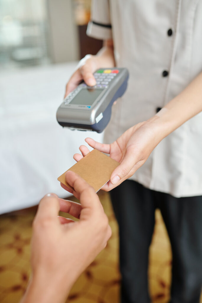 Hotel maid with payment terminal
